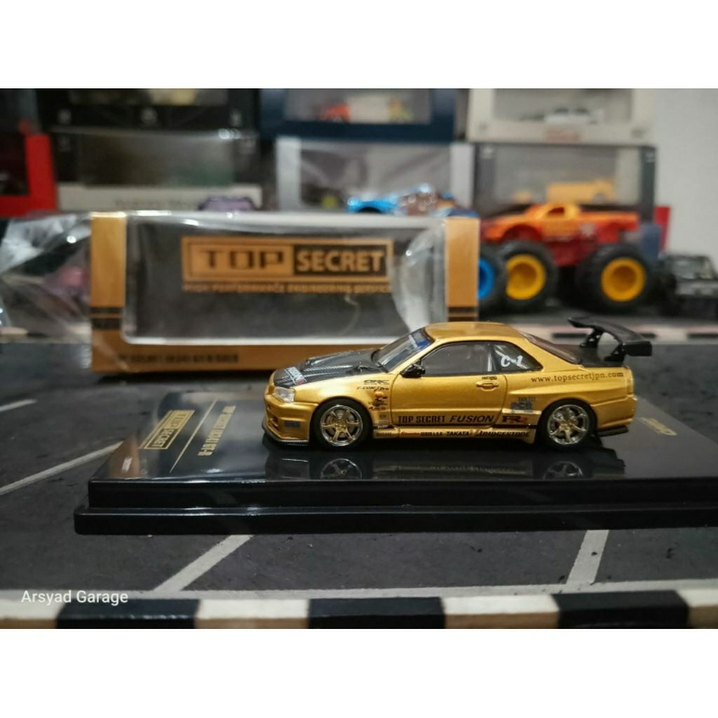 Diecast Inno64 Nissan Skyline GTR R34 Top Secret Gold