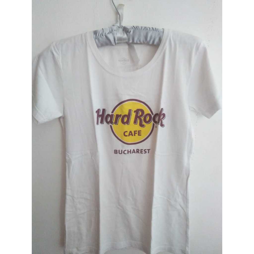 Preloved Kaos Wanita Hard Rock Caffe Stockholm Warna Putih Motif Logo Oray