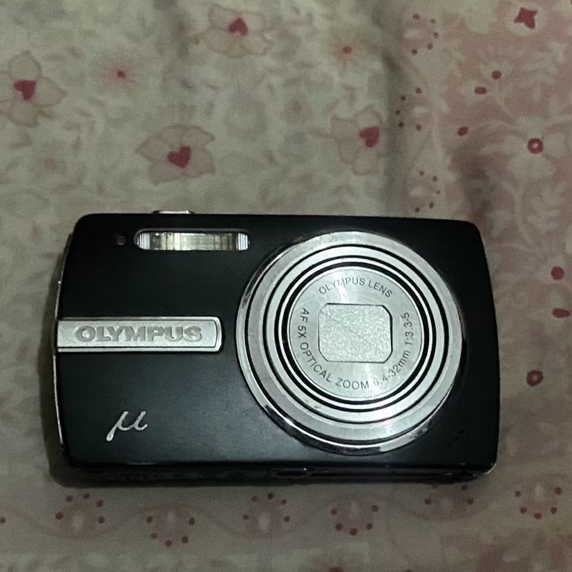 olympus m840 lensa keluar