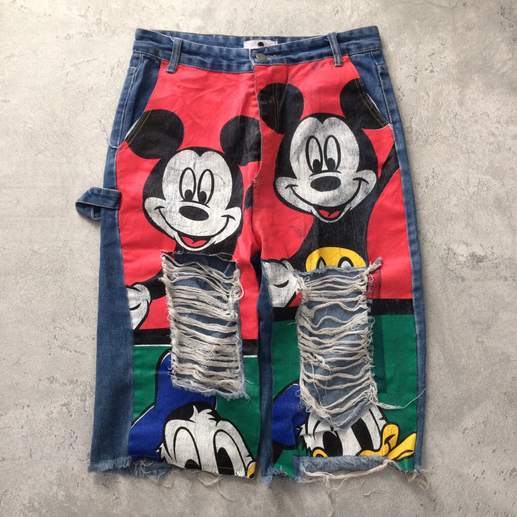 Customised denim jeans featuring Mickey Mouse character design