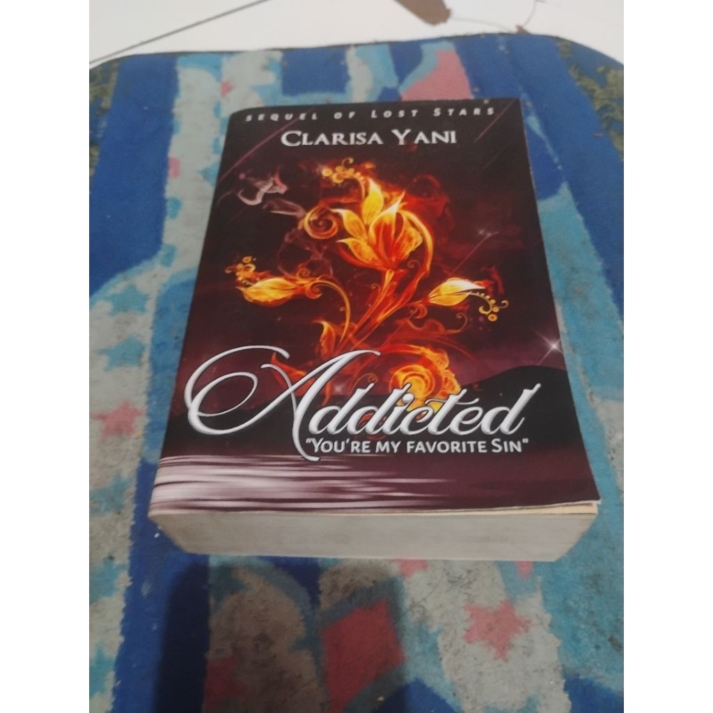 Buku novel bekas original "Addicted" karya Clarisa Yani,