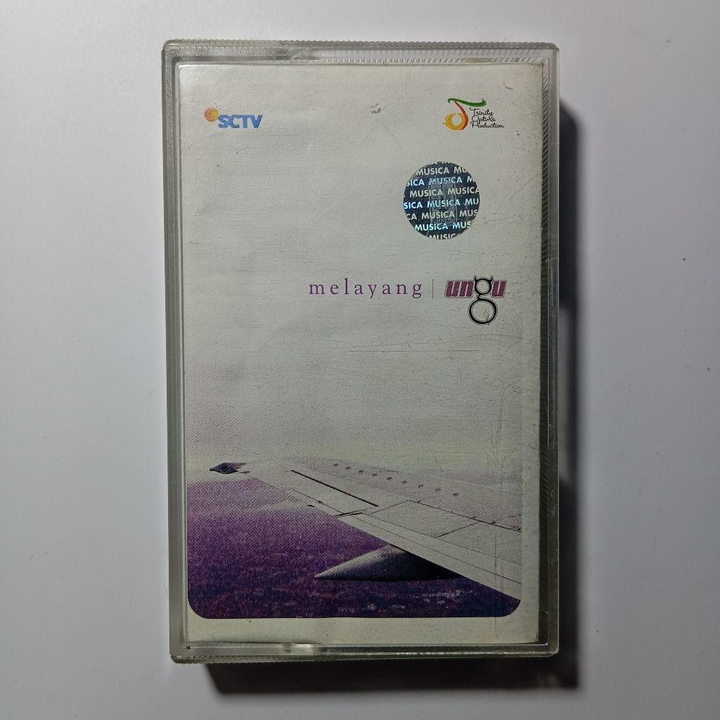 Kaset Pita Ungu - melayang