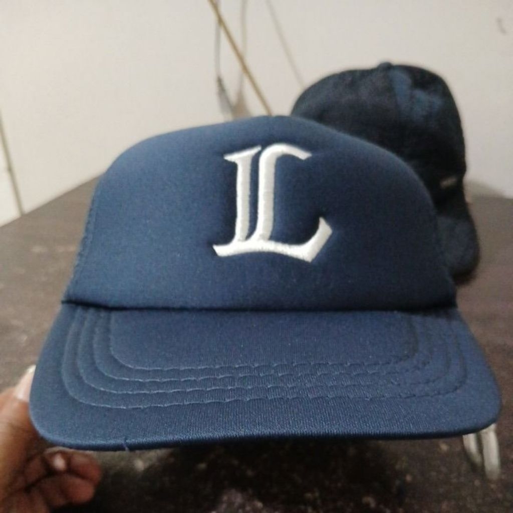 Topi tracker warna navy pekat dangkal visor pendek logo bordir LIONS second Original allsize stelan 