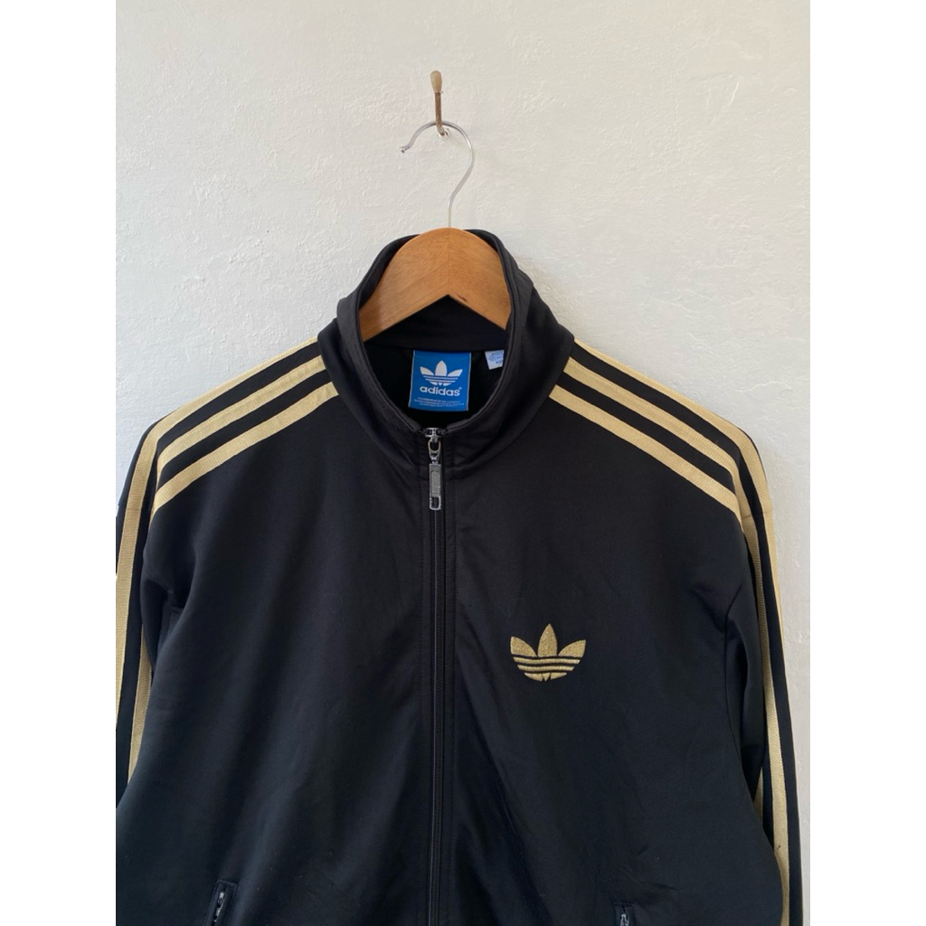 Tracktop Adidas Firebird Hitam Gold Stripe
