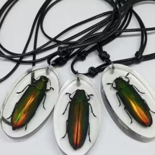 Kalung kumbang permata samber lilin