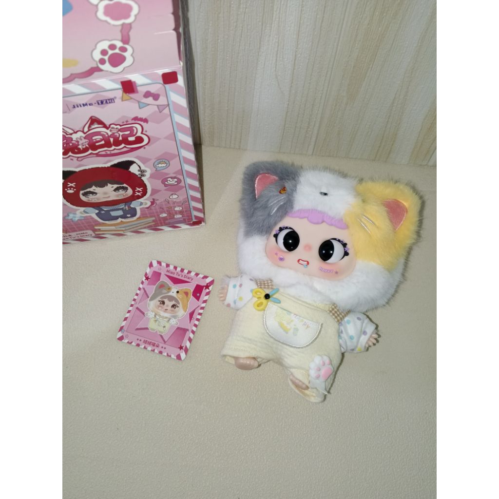 Jimo kucing calico lucu