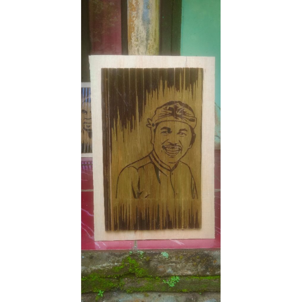 ukiran bambu hitam motif wajah