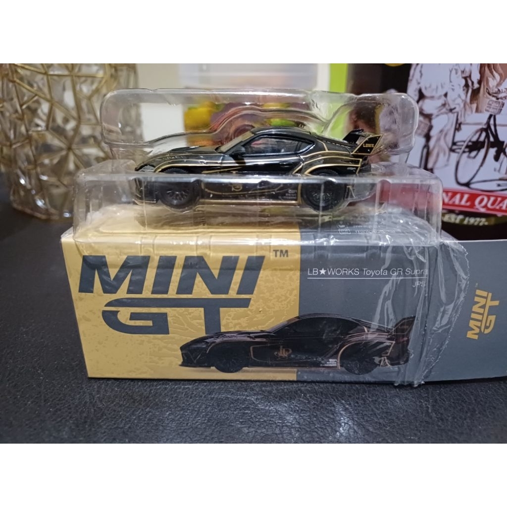 Mini GT 325 LBWK Toyota Supra JPS Unsealed
