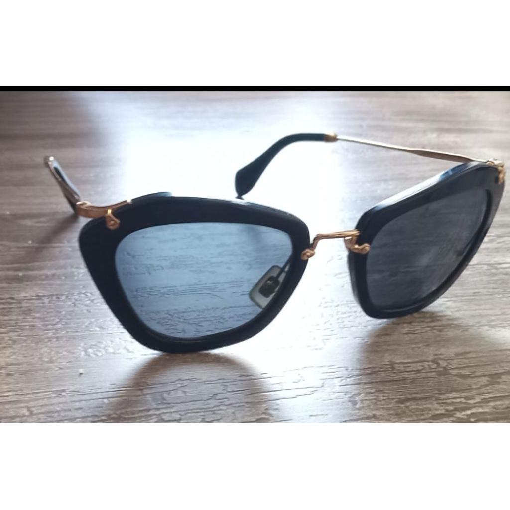 Miumiu black and gold cat eye sunglasses