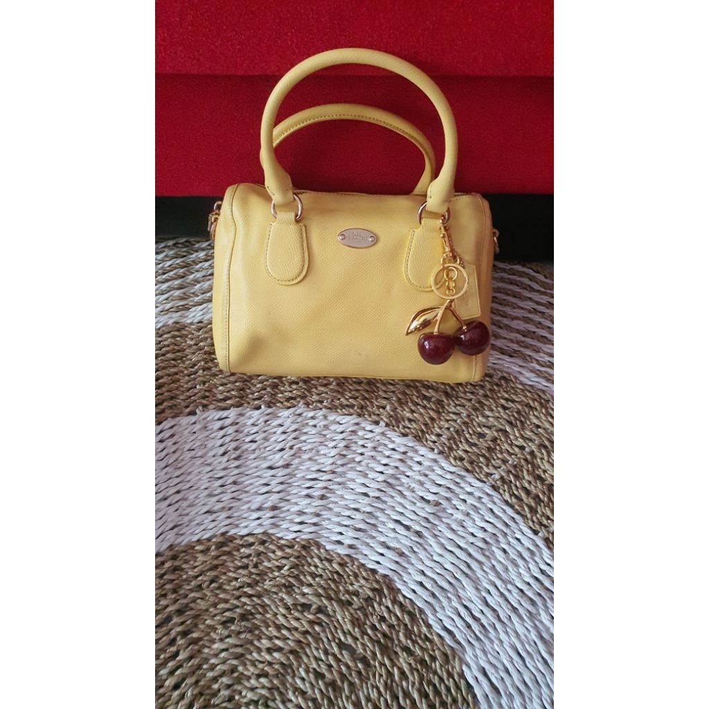 tas coach speedy kuning