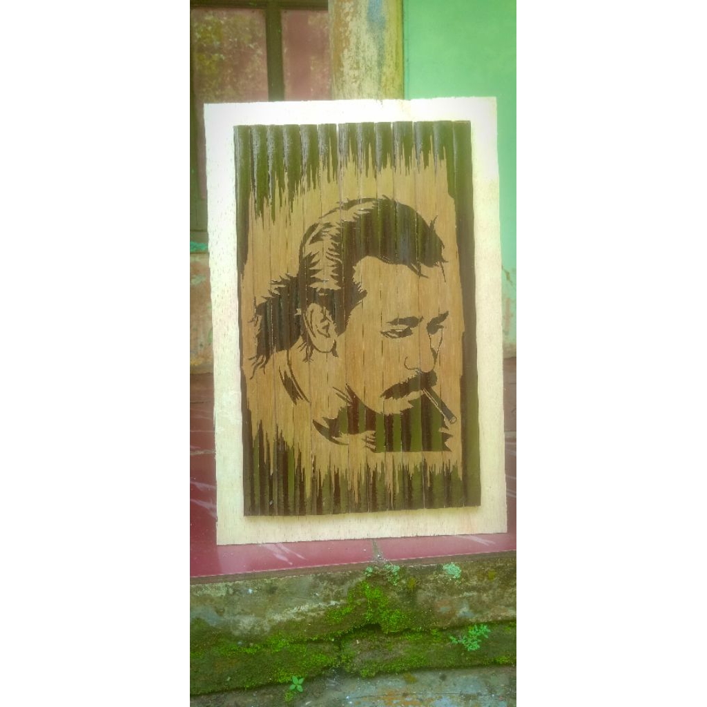 ukiran bambu hitam motif wajah