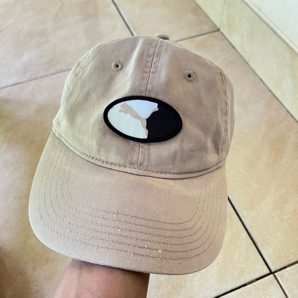 topi puma logo