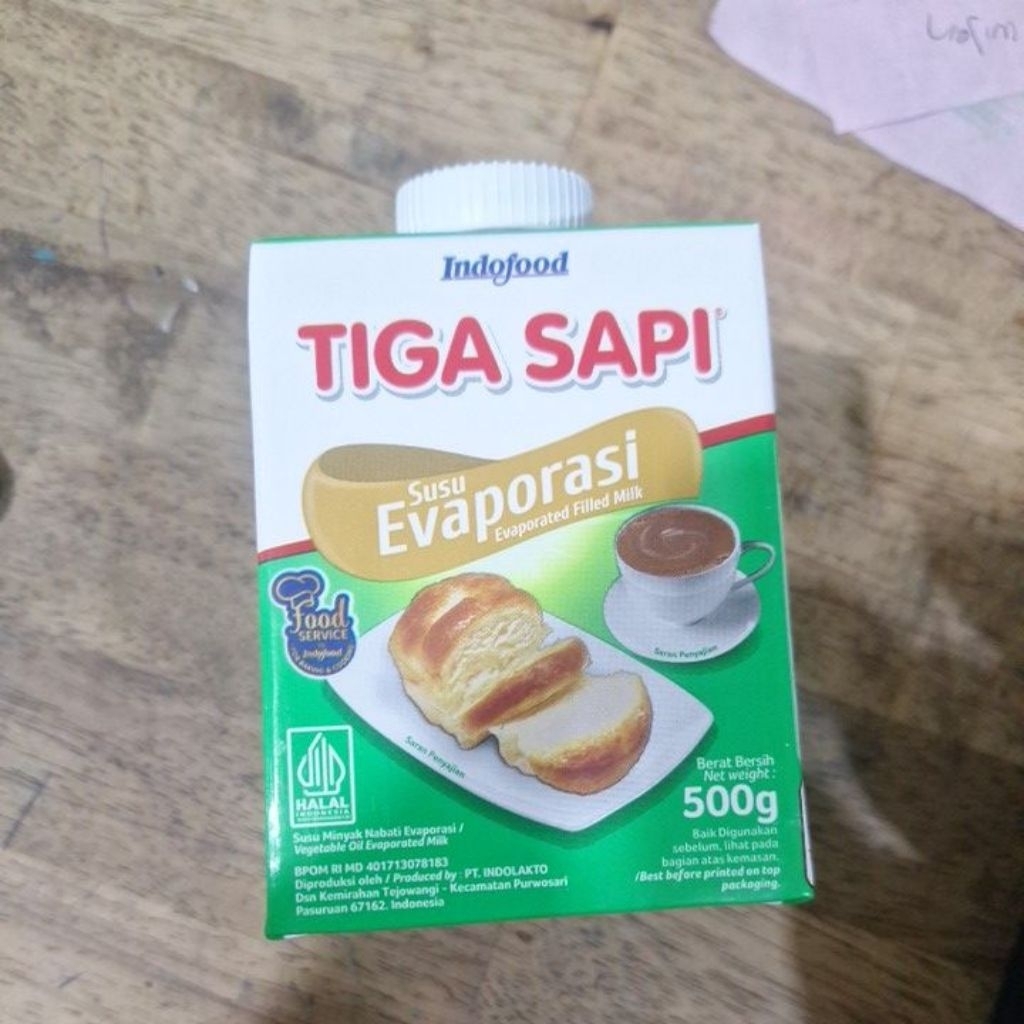 Susu Evaporasi Tiga Sapi 1 Karton Isi 12 Botol