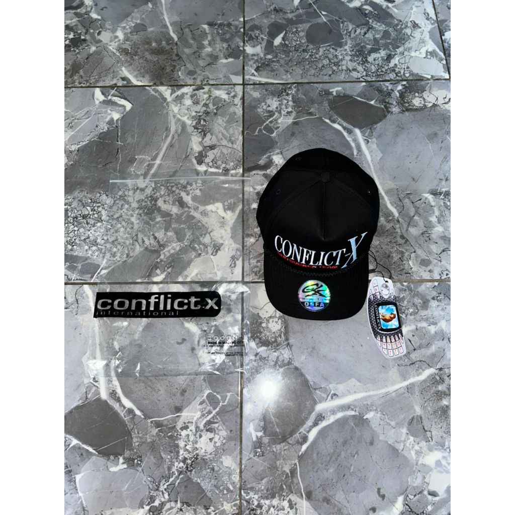 TOPI CONFLICT X