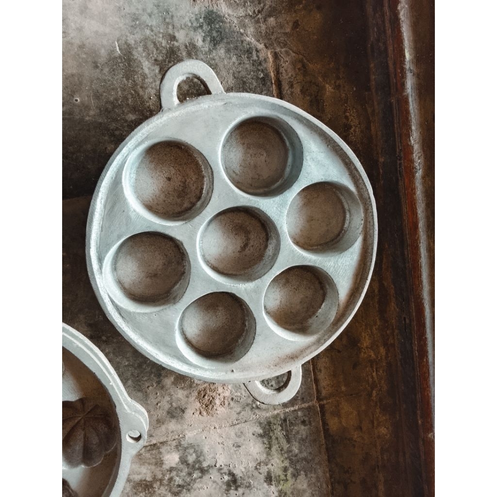 cetakan kue lumpur