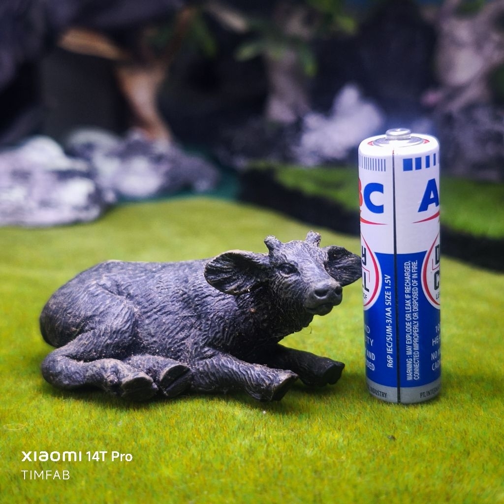 New canna sitting buffalo figure