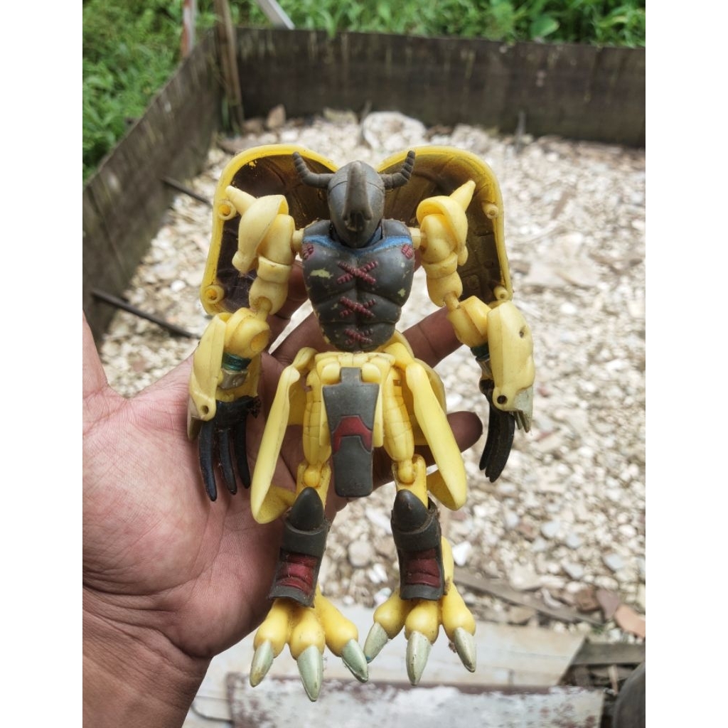action figure digivolving wargreymon