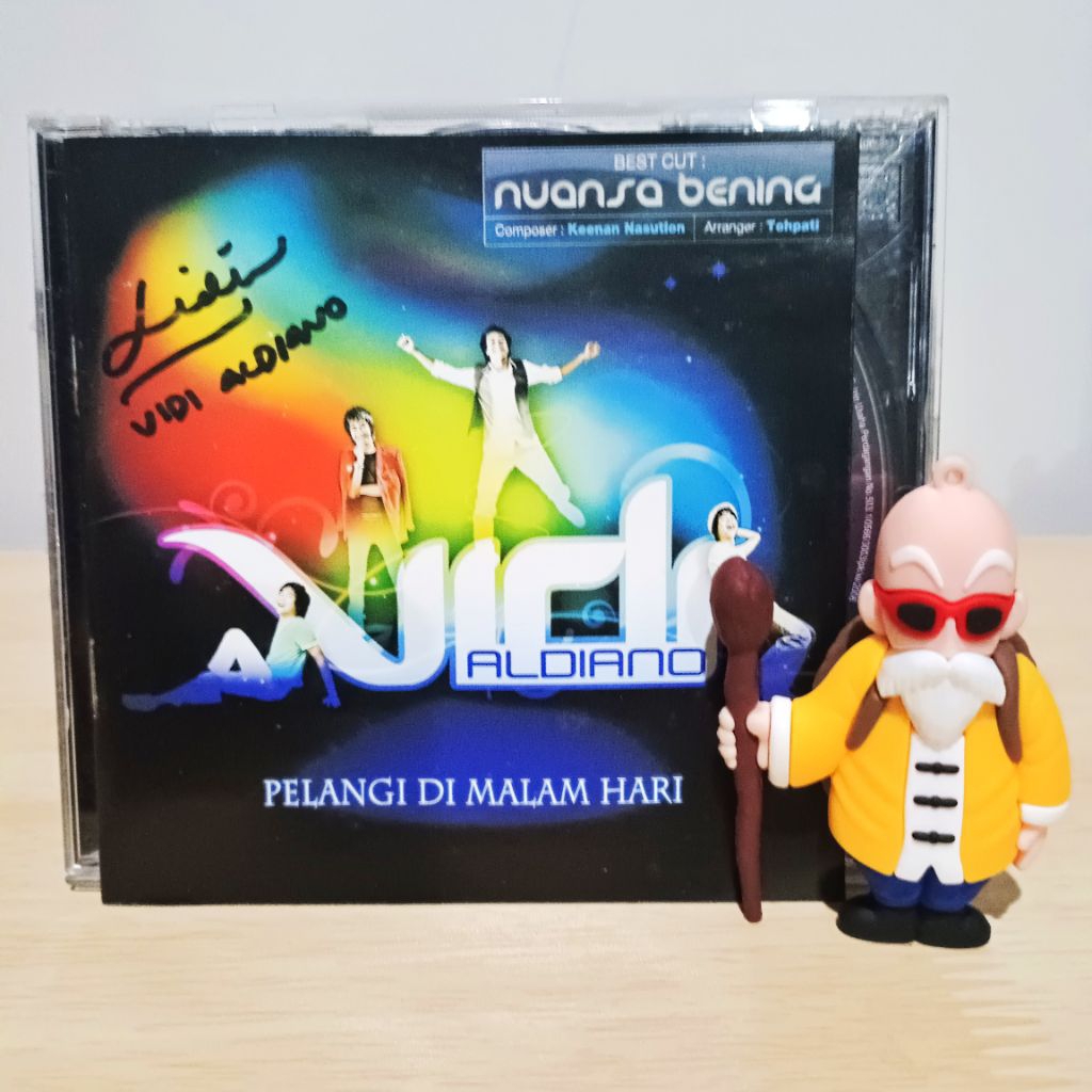 CD Vidi Aldiano Pelangi Dimatamu Tanda tangan