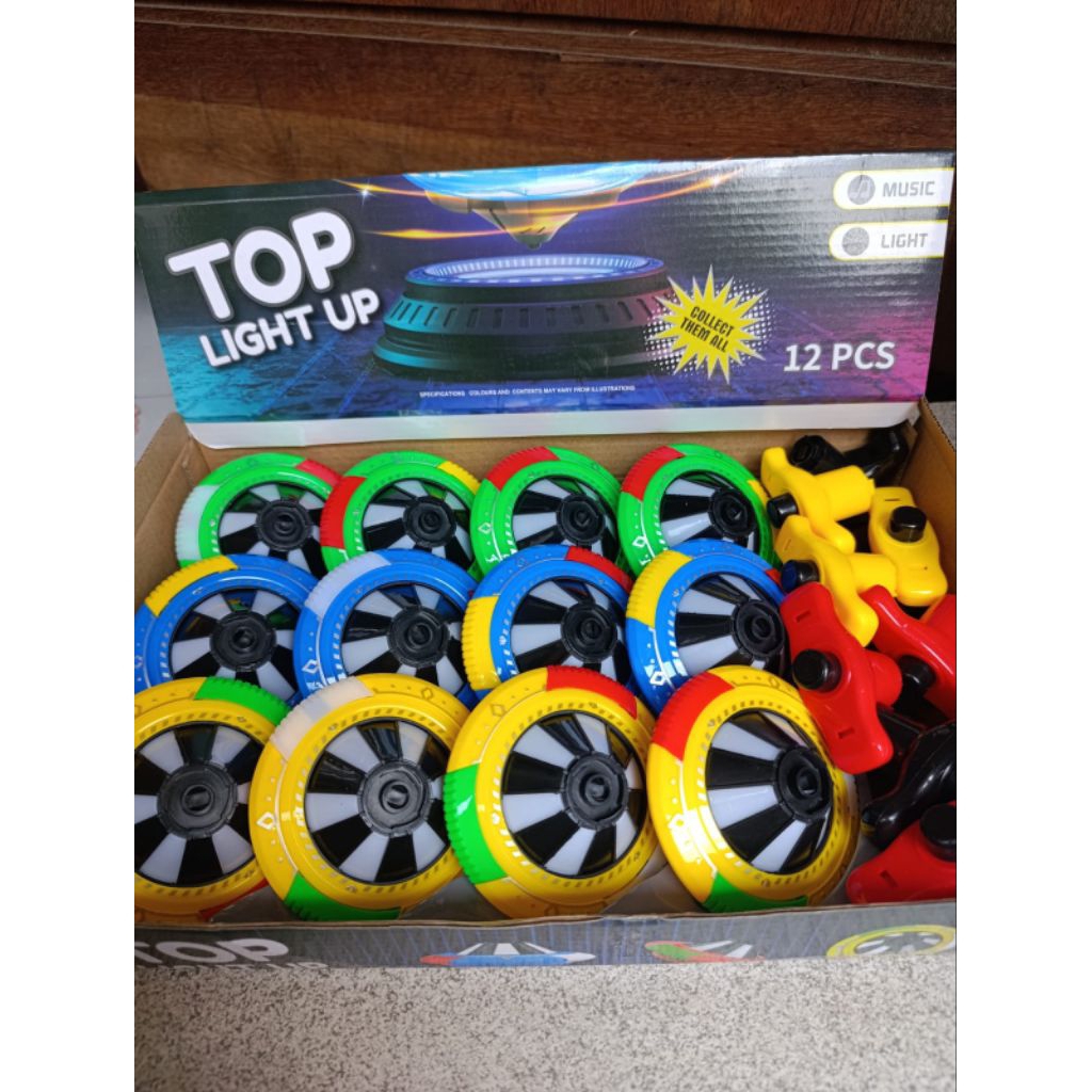 mainan gangsing musik dan lampu laser