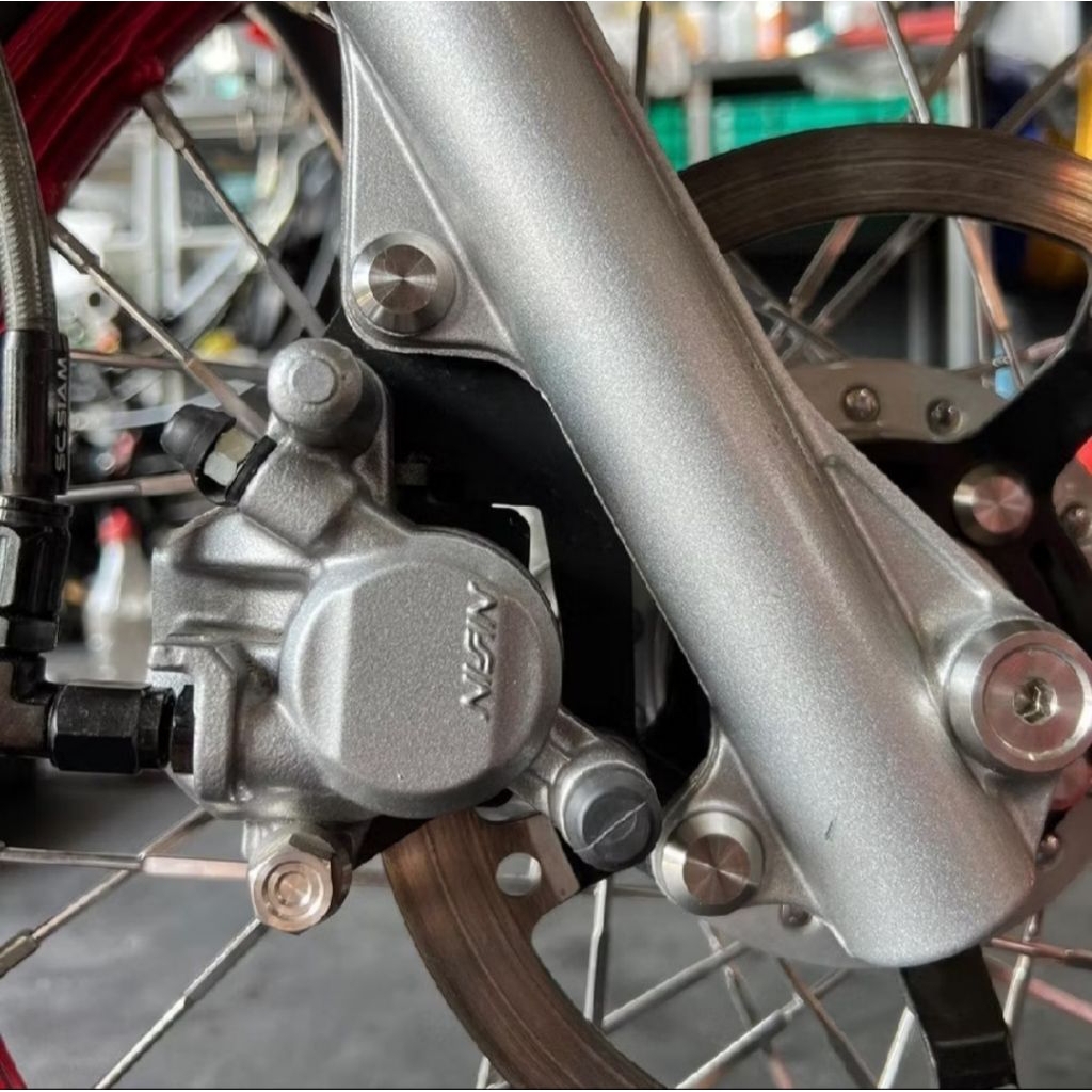BAUT BREKET KALIPER BUTA HONDA ORIGINAL HENG THAILAND