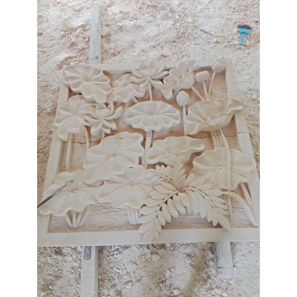 relief ukir batu alam bunga lotus