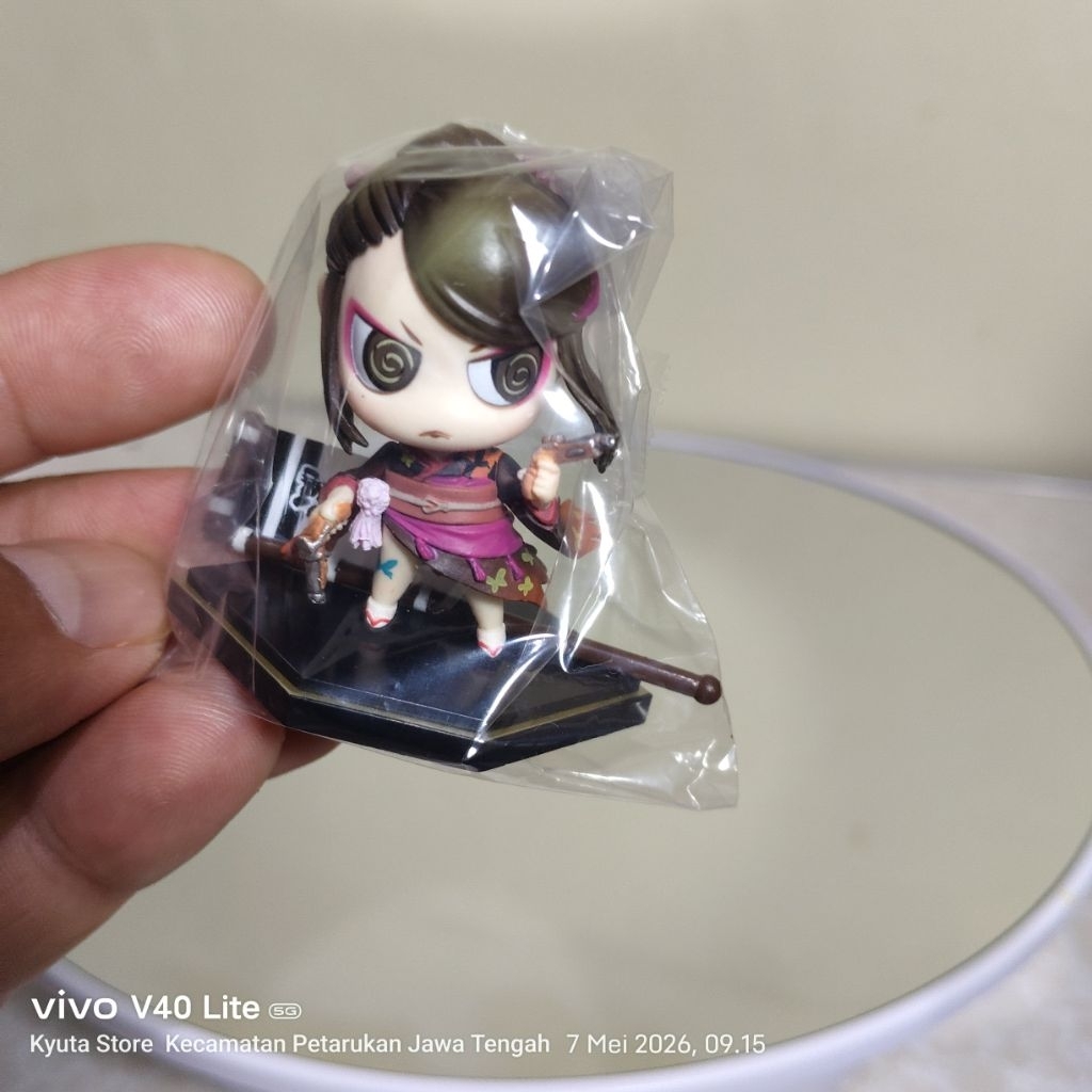 figur koleksi Nōhime dari seri Sengoku Basara, yang diproduksi oleh Kotobukiya dalam lini "One Coin 