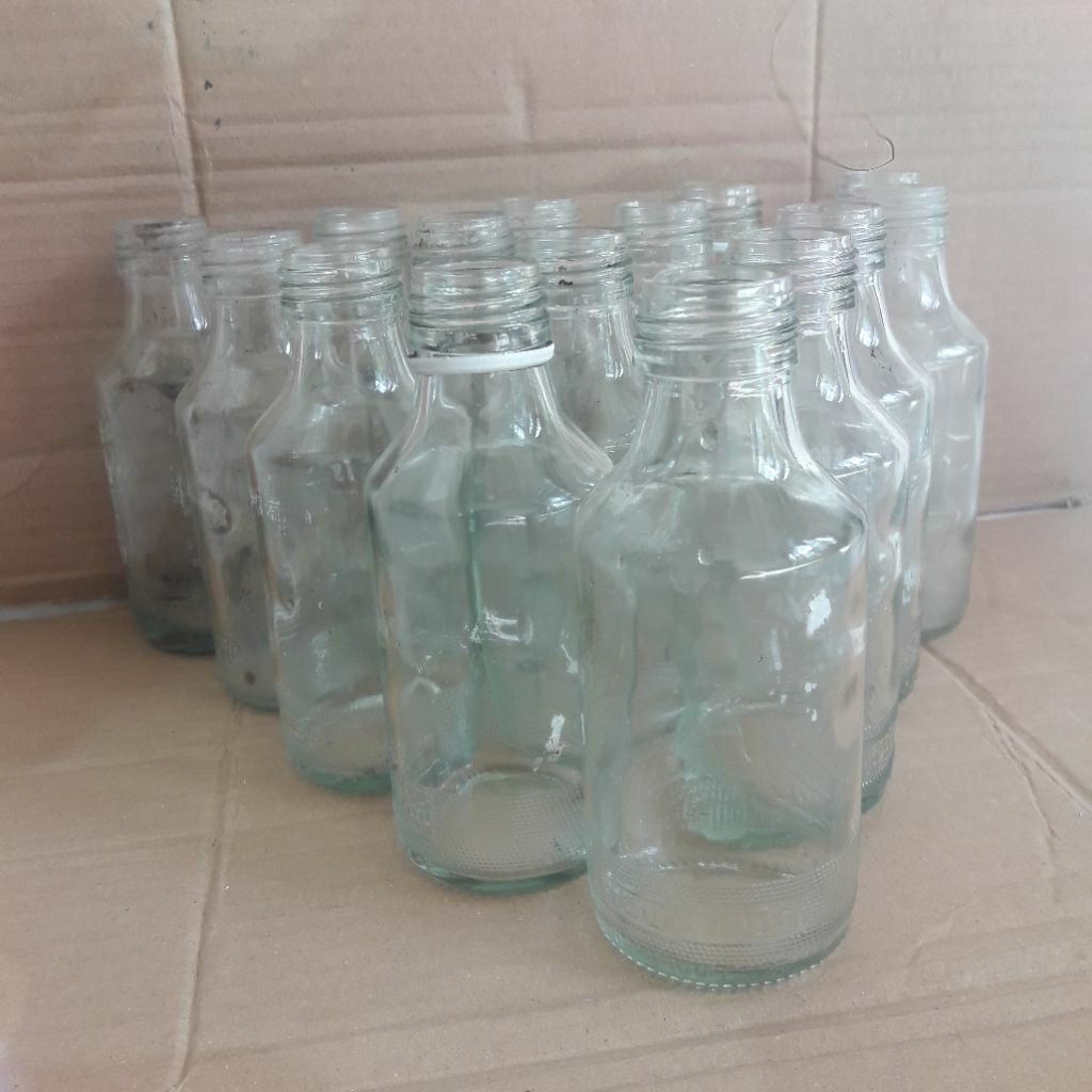 Botol kaca bekas U C 1000 sudah bersih tanpa tutup