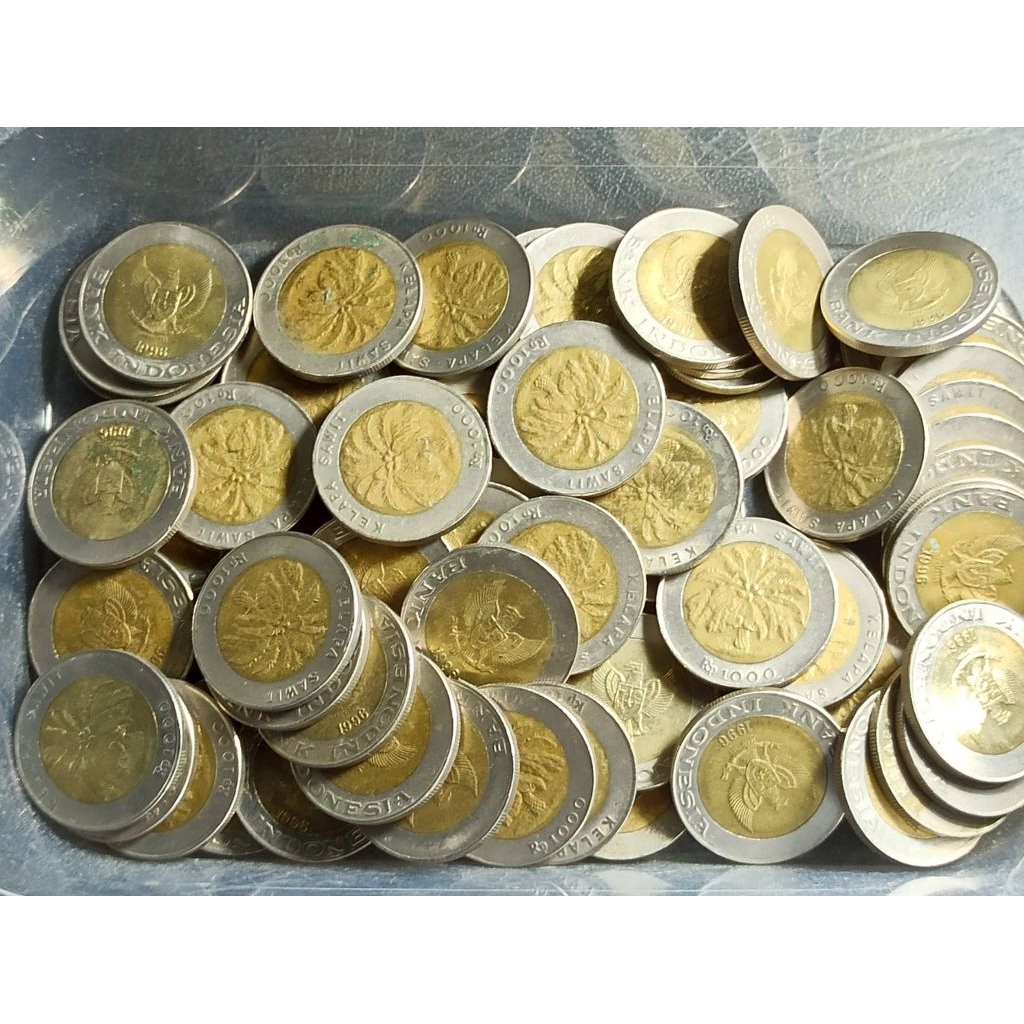 Koin kelapa sawit .1000 kelapa sawit . seribu rupiah kelapa sawit