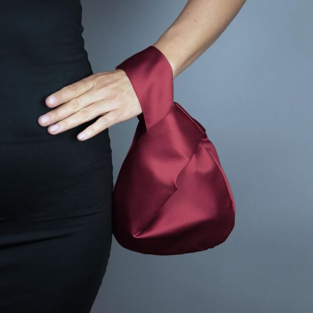 souvenir satin knotted handbag