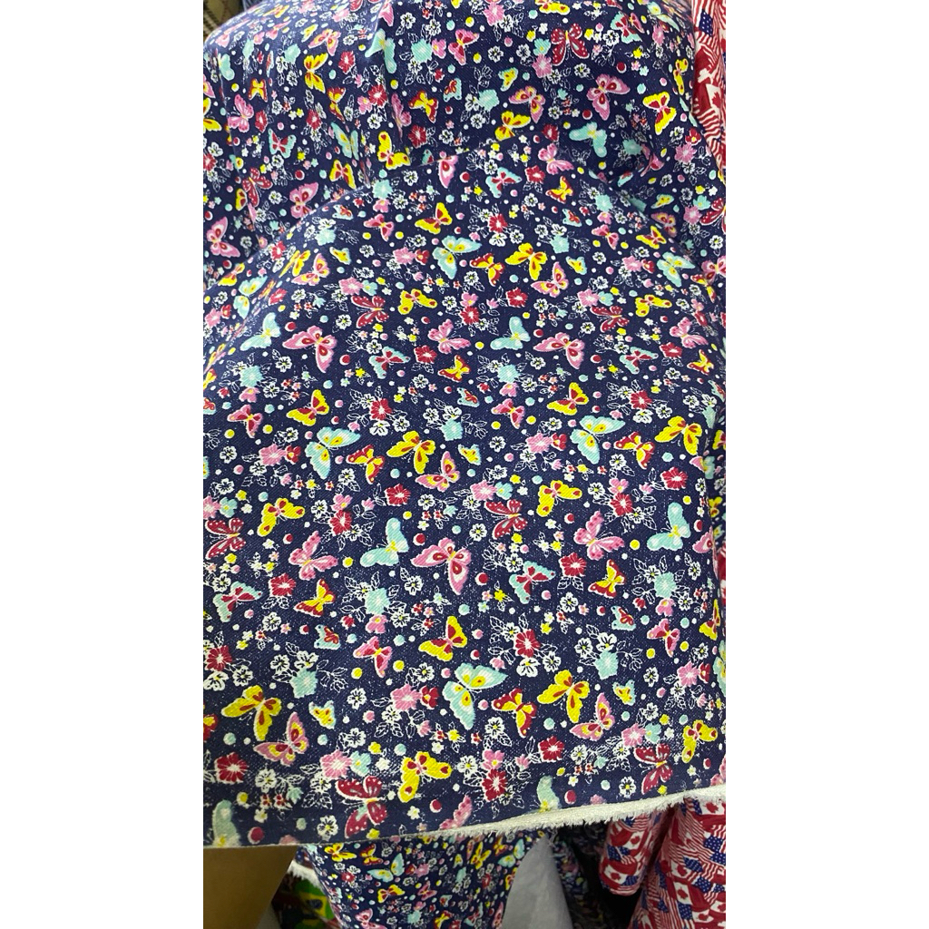 kain denim motif kupu kupu