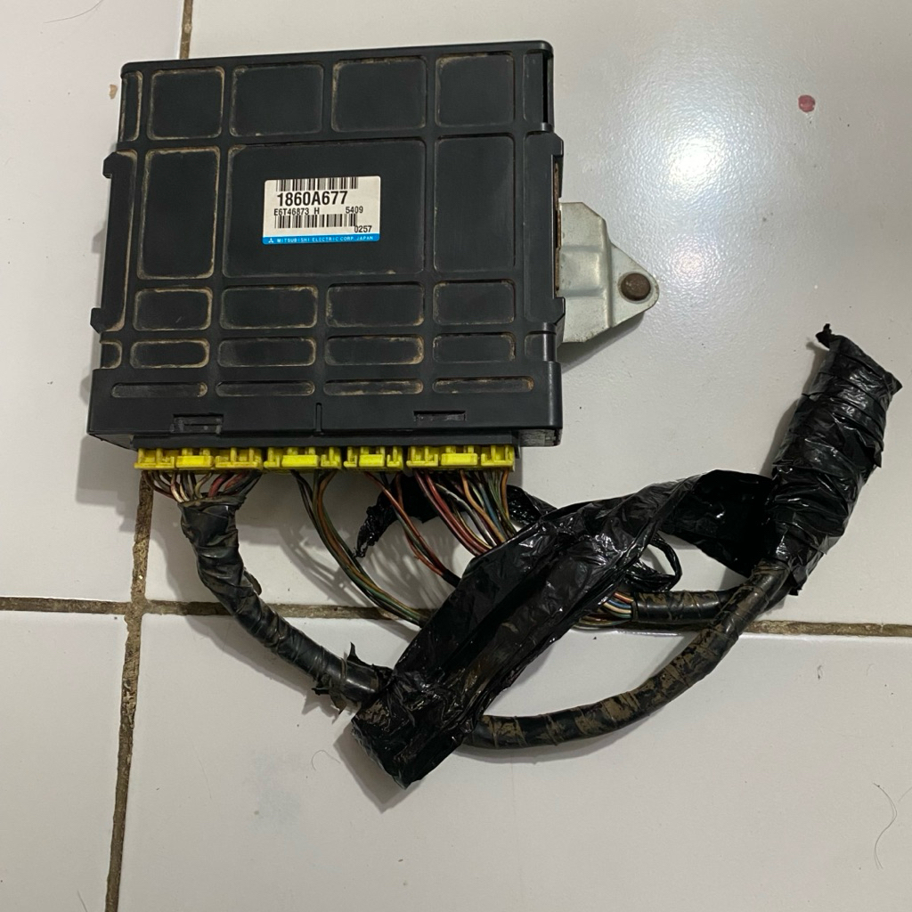 ecu mitsubishi t120ss injeksi copotan mobil original