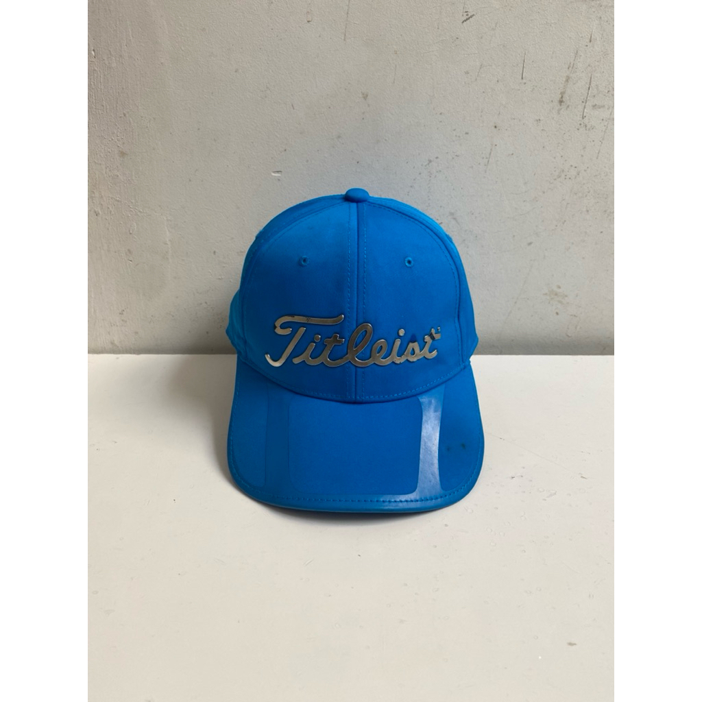 Topi running titleist