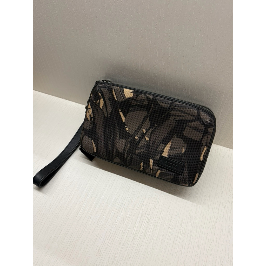 Tumi Alpha triple zip clutch bag