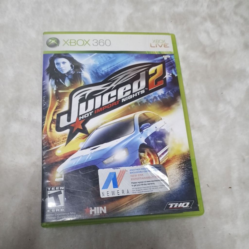 kaset game Juiced 2: Hot Import Nights untuk konsol Xbox 360.