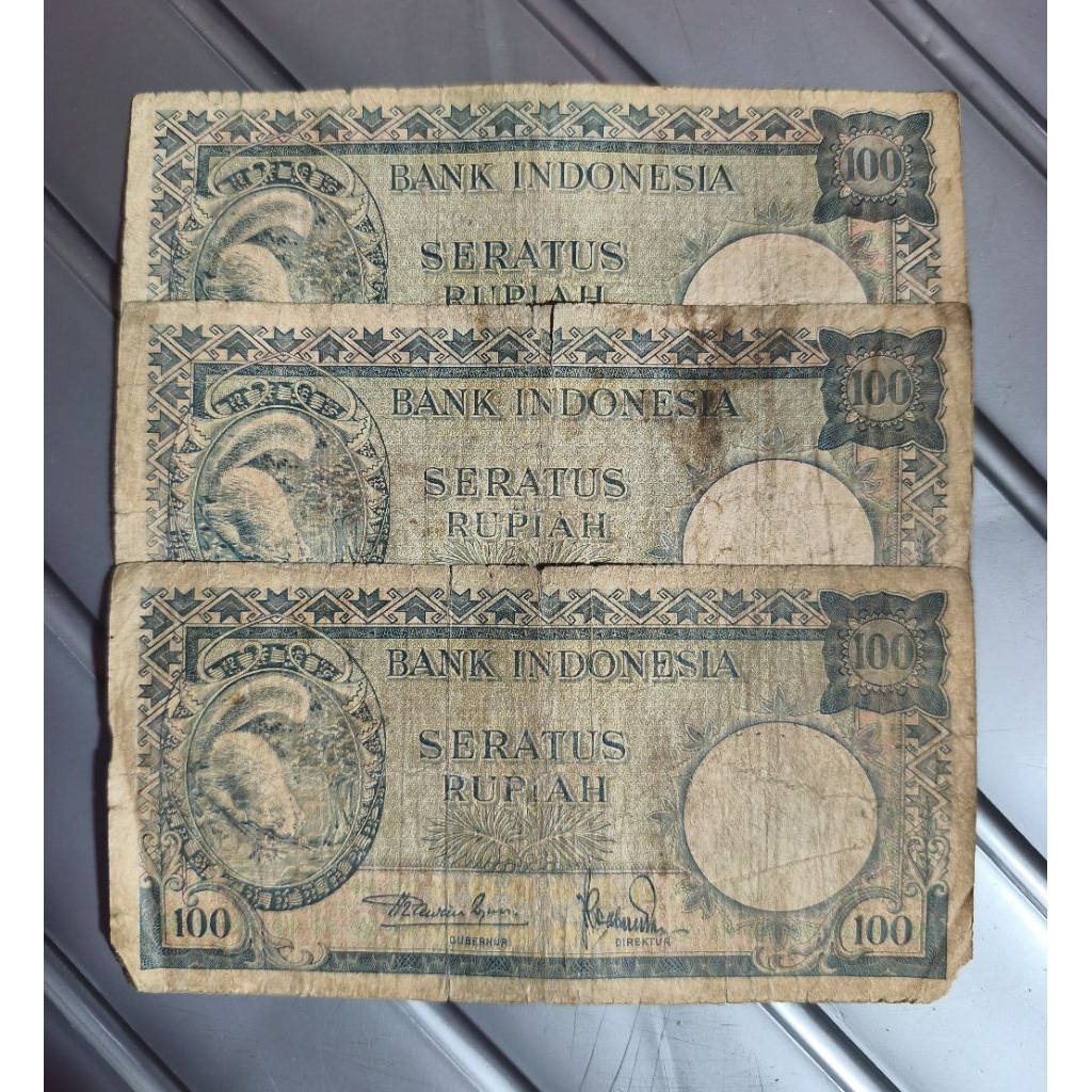 uang kuno 100 rupiah TUPAI thn 1957 bekas beredar jelek asli