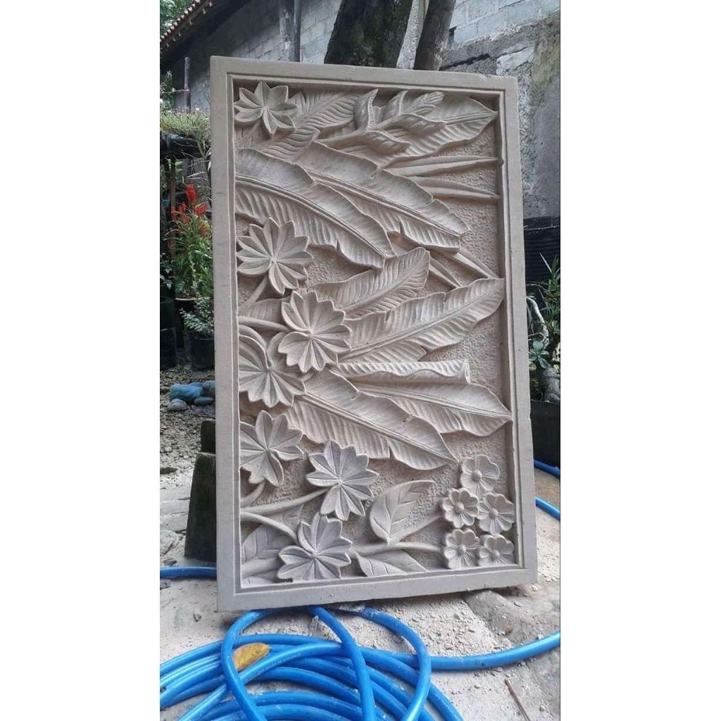 relief batu ukir dinding rumah