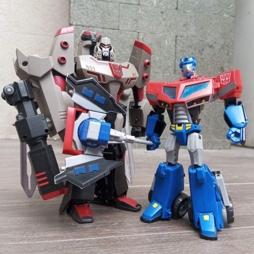 Transformers Animated Optimus Megatron baca deskripsi