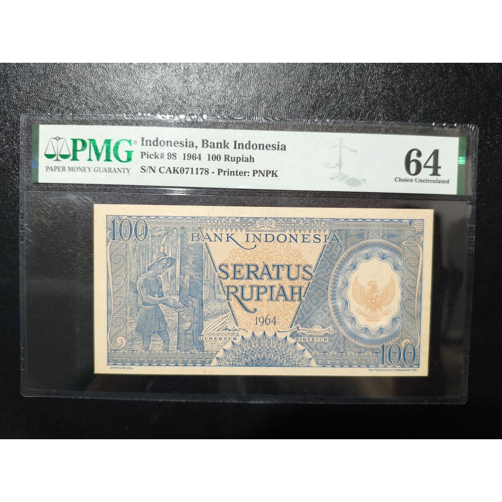 Uang kertas kuno 100 rupiah pekerja biru tahun 1964 PMG 64