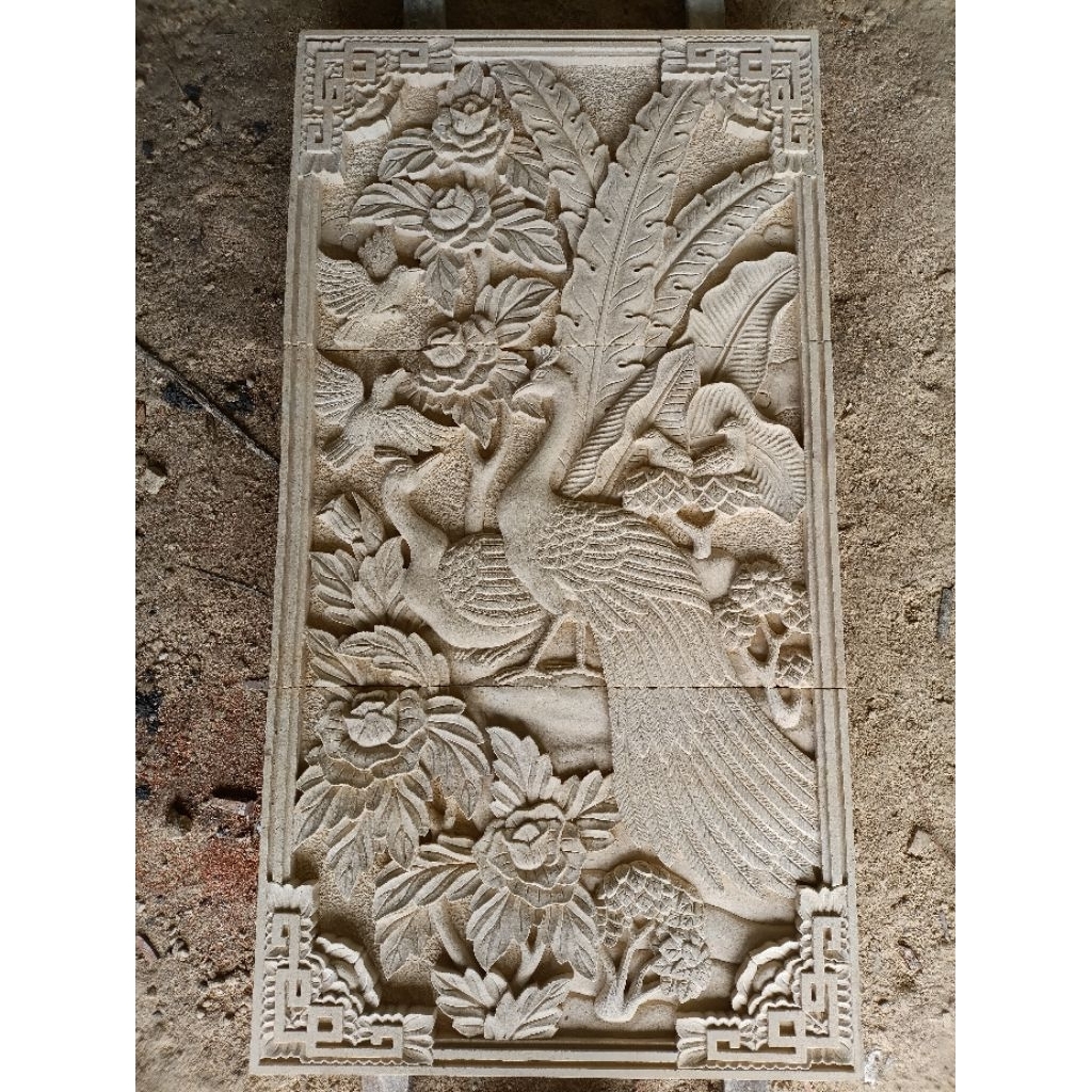 relief merak batu alam paras jogja