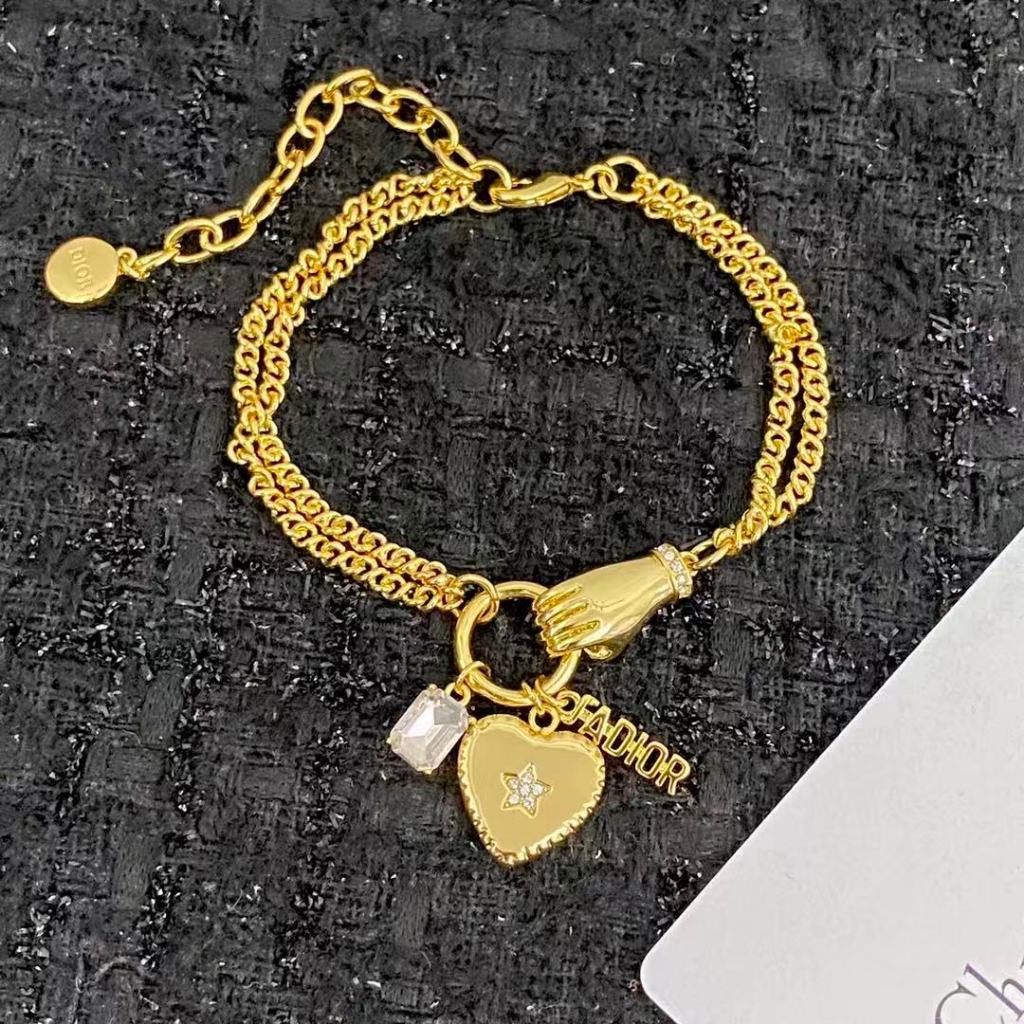 Jadior vintage double-layer gold bracelet with multiple pendant designs, niche yet exquisite