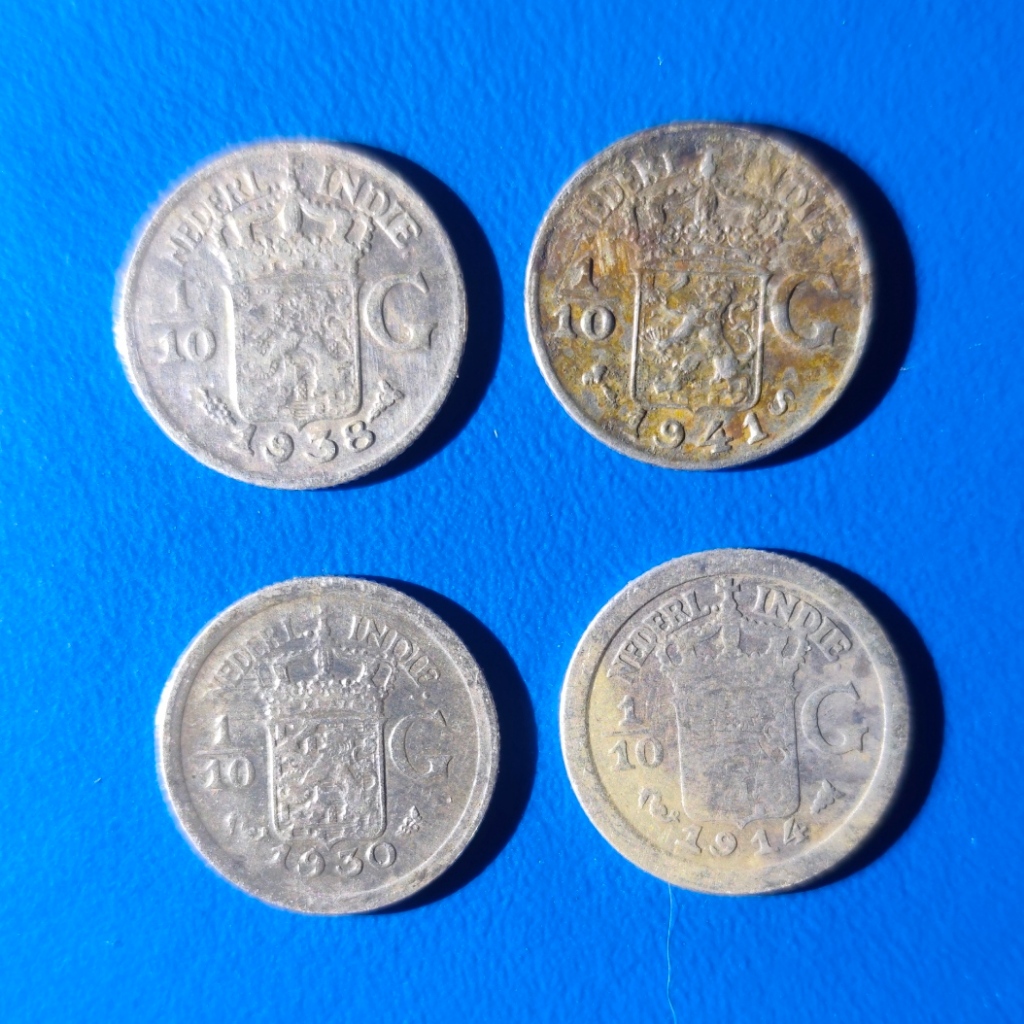 4 keping koin perak 1/10 gulden Hindia-Belanda tahun 1914,1930,1938,1941