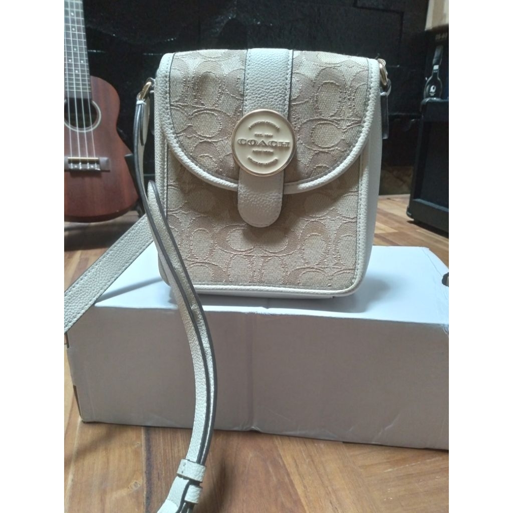 Preloved mini sling bag Coach