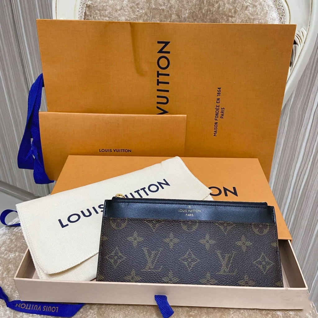 Dompet lipat Louis Vuitton Slim Purse pre-owned dari Prancis, kode M80348, model panjang dengan bany
