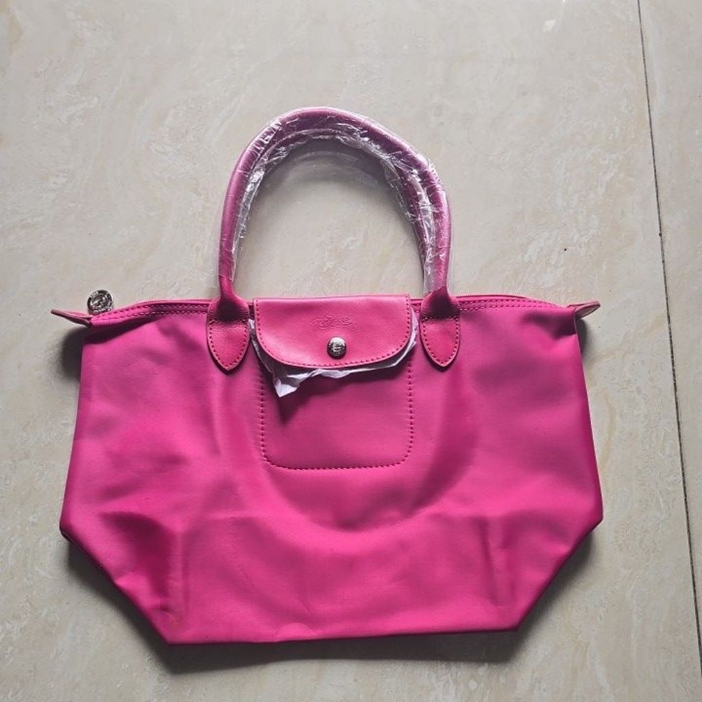 Tas.aku- New tas LongCamp ada defect- pink fushia-baca deskripsi