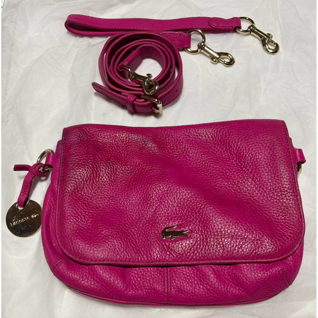 Lacoste fuschia sling bag/wrislet