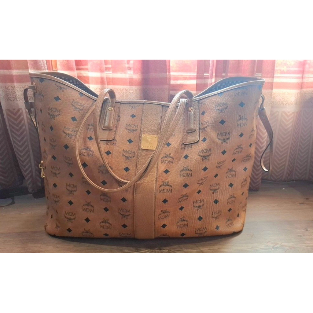 MCM Liz Reversible Shopper Tote Bag in Cognac Visetos coated canvas.