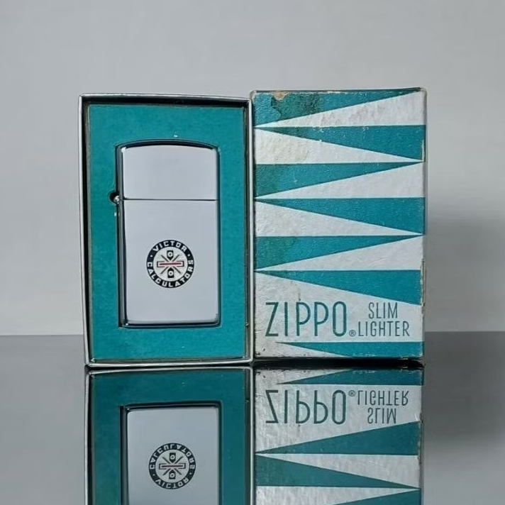 ZIPPO SLIM VINTAGE TAHUN 1960 ADVERTISING VICTOR TECHNOLOGY LLG