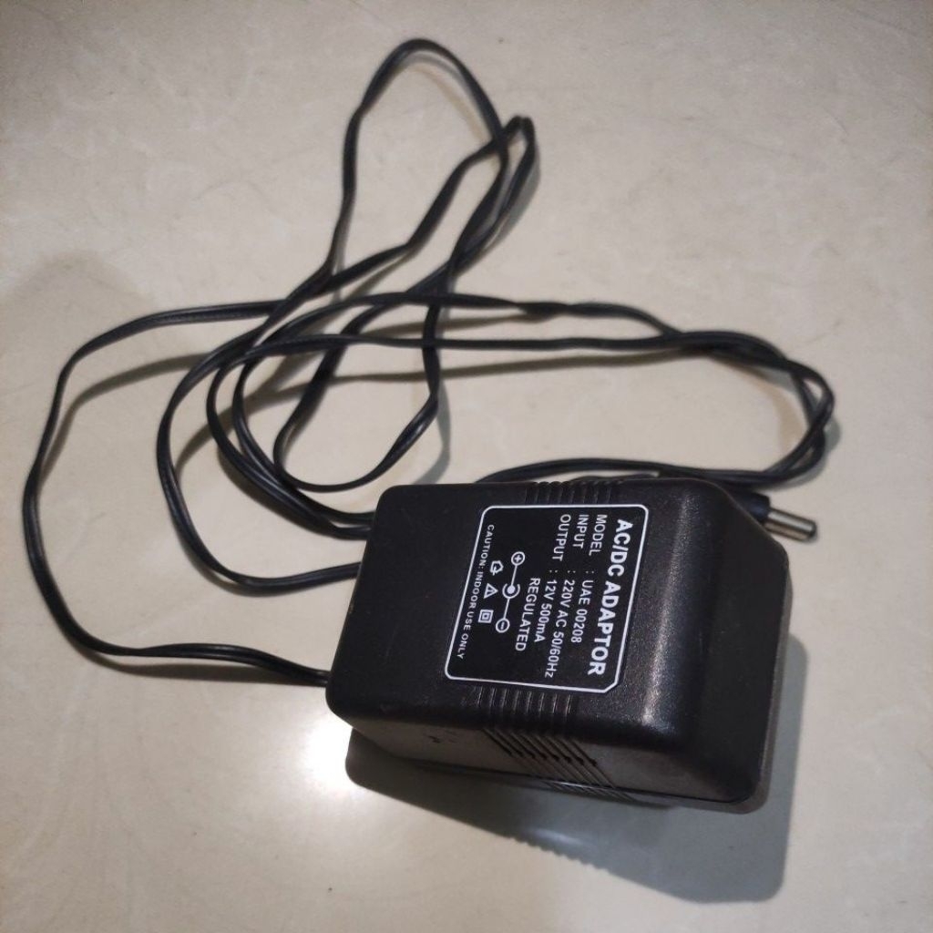 AC/DC Adaptor 12V 500mA Tipe : UAE 00208 Original