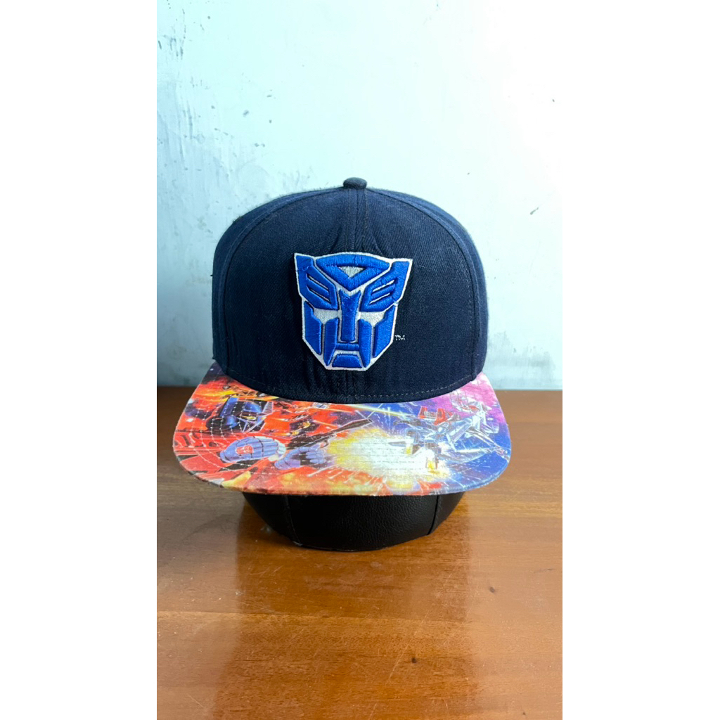 topi karakter transformer visor aop original second