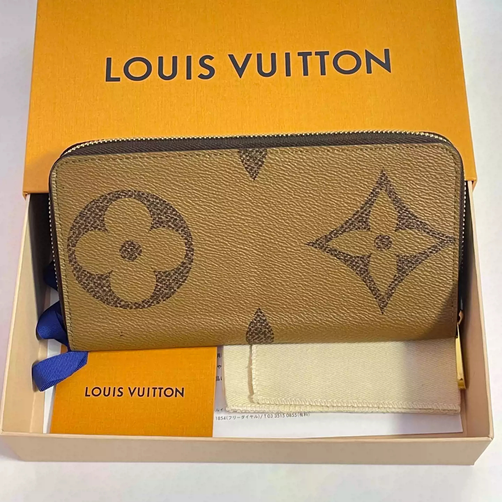 Tas dompet panjang Louis Vuitton bekas dari Prancis, model M67687, berbahan kulit sapi berwarna coke
